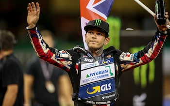 Tai Woffinden on top of the podium