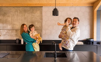 Mark and Jane Dolan with their children Sonny and Amelie in their retrofitted Victorian home in north-east London