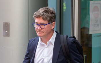 Graham Johnson leaving the High Court in London