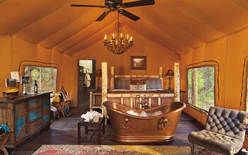 The Resort at Paws Up, Montana, whose ‘Cliffside Camp’ tent (sleeps two) includes a roll-top copper bath, king-size bed and private butler