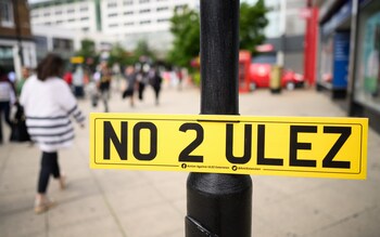 A "NO 2 ULEZ" sign is seen in a shopping precinct
