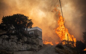 Flames burn in the village of Gennadi on the Greek island of Rhodes