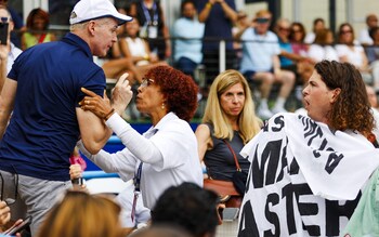 Climate protests cause some tense-looking scenes in the stands during Andy Murray's match with Taylor Fitz at the Citi Open in Washington